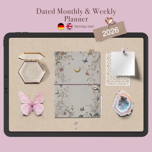 May include: A digital planner with a floral design, a butterfly, and a decorative box. The planner is dated for 2026 and includes a weekly and monthly layout. The image also includes a decorative crystal and a paper cutout.