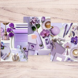 May include: A collection of purple-themed office supplies and accessories, including a laptop, pens, stapler, and a coffee cup. The image also features flowers and a decorative light fixture, all arranged on a light wooden surface.