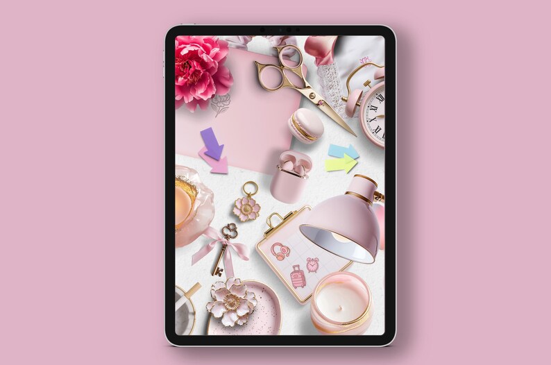 May include: A pink tablet screen displaying a flat lay of various pink and gold decorative items, including a flower, a key, a lamp, a candle, a clock, and a pair of scissors.