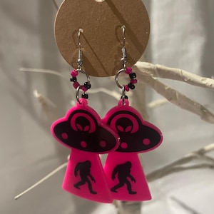 Neon Pink and Black Dangle UFO Earrings with Alien and Bigfoot. Alien abduction fun.
