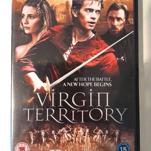 May include: A DVD case for the film Virgin Territory featuring Hayden Christensen, Mischa Barton, and Tim Roth. The cover art displays the actors, a sword, and a group of riders on horseback. Text includes the title, the tagline After the battle, a new hope begins, and two 15 age rating symbols.