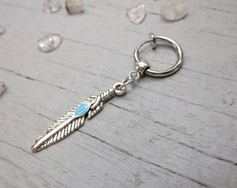 A PAIR OF LONG WHITE FEATHER DANGLY CLIP ON EARRINGS