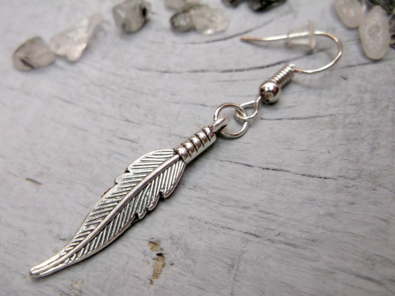 One feather earring Symbolic meaning Feather dangle Men Etsy