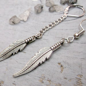 One feather earring, Symbolic meaning, Feather dangle, Men earring, Silver feather, Symbol feather dangle Gift for him Crow feather men gift