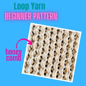 May include: A close-up of a beige knitted blanket with a honeycomb pattern. The blanket is made with loop yarn and is a beginner-friendly project.