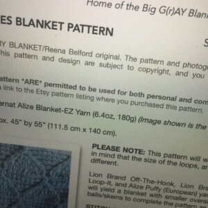 May include: A close-up of a crochet blanket pattern with instructions for making a blanket using Alize Blanket-EZ yarn. The pattern is 45 inches by 55 inches (111.5 cm x 140 cm).