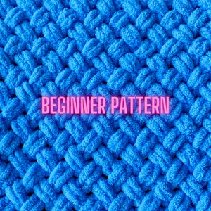 May include: Close-up of a blue knitted fabric with a textured surface. The text "BEGINNER PATTERN" is written in pink letters across the fabric.