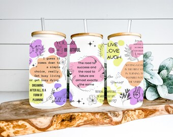 16 oz positive energy glass tumbler with bamboo lid and plastic straw.