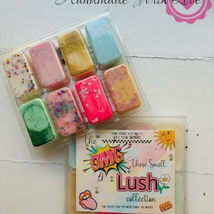 May include: Two clear plastic containers of scented wax melts. The top container holds eight rectangular melts in shades of pink, green, and blue, decorated with glitter and sprinkles. The bottom container has six melts and a card that reads "The OMG These Smell Lush collection."