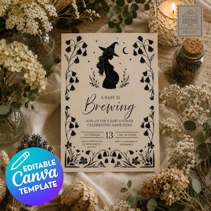 May include: A rectangular cream-colored baby shower invitation card featuring a black silhouette of a pregnant person wearing a witch hat, surrounded by floral borders and the text A BABY IS BREWING, JOIN US FOR A BABY SHOWER, and event details.