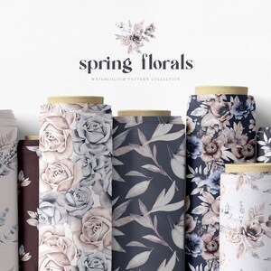 May include: A collection of eight fabric rolls featuring watercolor floral patterns. The patterns include roses, anemones, and leaves in shades of blue, pink, and white on a dark blue background. The text "spring florals" and "WATERCOLOUR PATTERN COLLECTION" is printed on a white background above the rolls.
