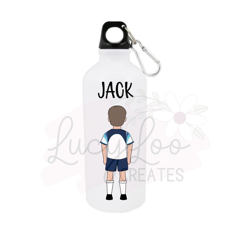May include: White water bottle with a black lid and a carabiner clip. The bottle has a cartoon illustration of a boy wearing a soccer uniform and the name "JACK" printed on the front.