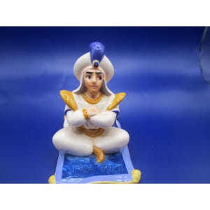 Vintage Alladin figure on Magic carpet