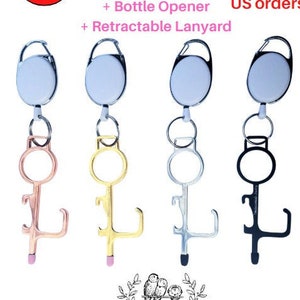 May include: Three door openers with retractable lanyards. Each opener is a different color: rose gold, gold, and silver. Each opener has a stylus tip, bottle opener, and door pusher. The text on the image reads: "Germ Free Door Opener + Door Pusher + Stylus Tip + Bottle Opener + Retractable Lanyard Free Shipping US orders".