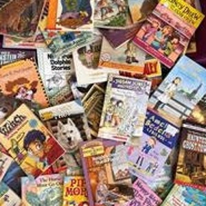 May include: A large collection of children's paperback books with colorful covers featuring various themes, including animals, adventure, and fantasy.