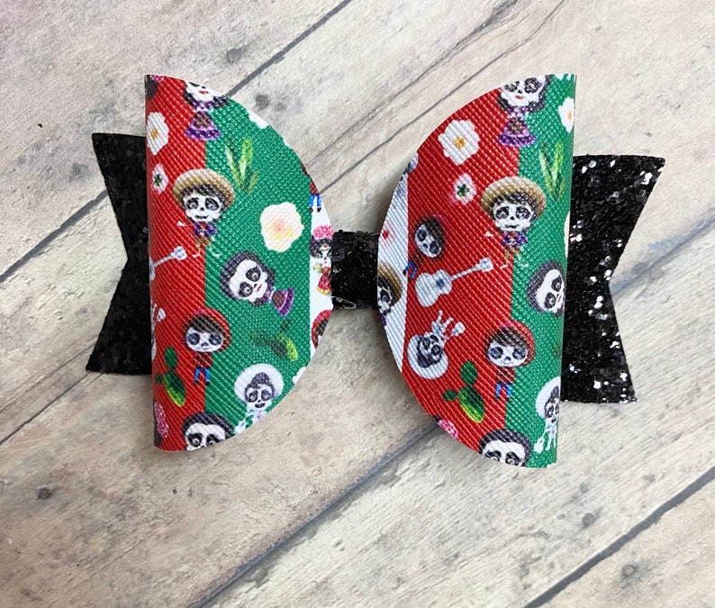 Coco inspired print faux leather bow
