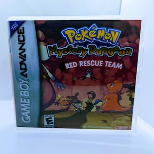 May include: Game Boy Advance game cartridge for Pokemon Mystery Dungeon: Red Rescue Team. The game case is red and features a cartoon image of various Pokemon characters.