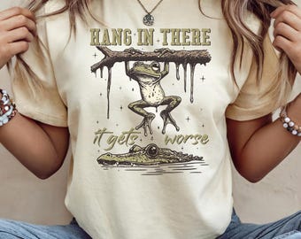 Funny Saying Frog Unisex Shirt "Hang in there, it gets worse", Sarcastic Frog Lover Shirt For Friend, Adult Humor Tee, Whitty Saying Shirt