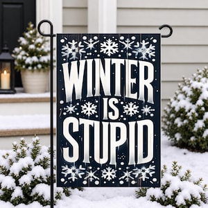 May include: A rectangular garden flag featuring a dark navy blue background with a vertical wood plank texture. The text WINTER IS STUPID is printed in large, bold, white capital letters, surrounded by various white snowflake illustrations.