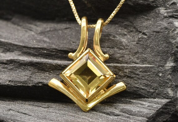 AA Natürliche, Goldene Tansanit-Ohrringe - 0,75 Ct