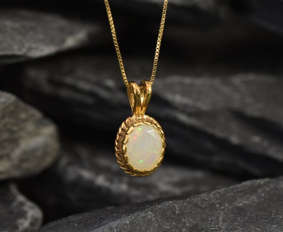 White opal and diamond 10ky gold pendant — Vintage Jewelers & Gifts, LLC.