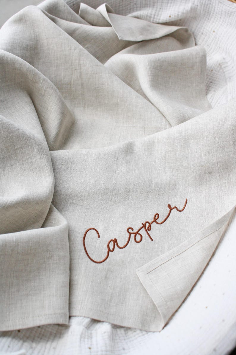 Natural linen baby blanket with name embroidery.