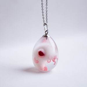 Baby cthulhu in egg pendant. Alien horror jewelry, necklace with cute octopus cryptid