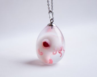 Baby cthulhu in egg pendant. Alien horror jewelry, necklace with cute octopus cryptid