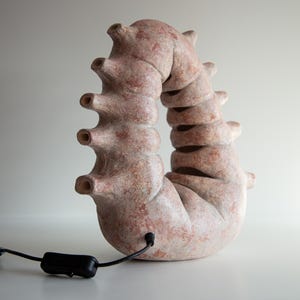 Ceramic unique table lamp in biomorphic style, alien artifact looking bionic blue night lights