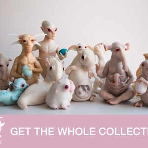 May include: A collection of 12 unique, hand-crafted, white porcelain figurines with various features, including horns, ears, and tails. Each figurine holds a small, round, blue or white object. The figurines are arranged on a white surface. The text "GET THE WHOLE COLLECTION!" is displayed on a pink background.