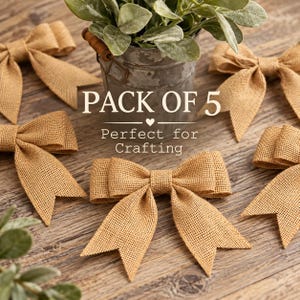 May include: A pack of five tan burlap bows with a woven texture, arranged around a gray metal bucket containing green foliage. The text PACK OF 5 and Perfect for Crafting is printed in white in the center of the image.