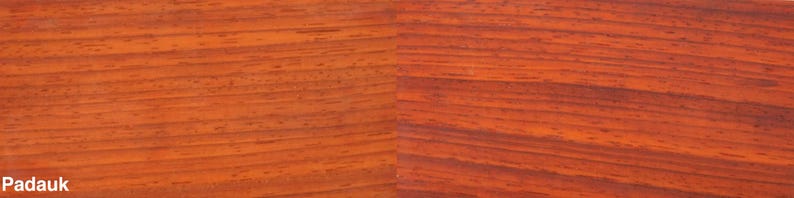 May include: Close-up of Padauk wood grain. The wood has a reddish-orange hue with dark, linear grain patterns. The word "Padauk" is printed in the lower left corner. This image showcases the natural beauty and texture of the wood.