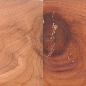 May include: Close-up of aromatic red cedar wood grain. The wood has a reddish-brown color with visible knots and swirling patterns. The text "Aromatic Red Cedar" is visible at the bottom left of the image.