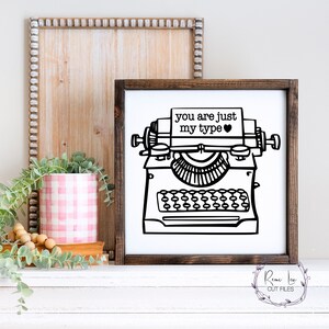 May include: Black and white illustration of a vintage typewriter with the text "you are just my type" on a white background. A heart symbol is next to the text.
