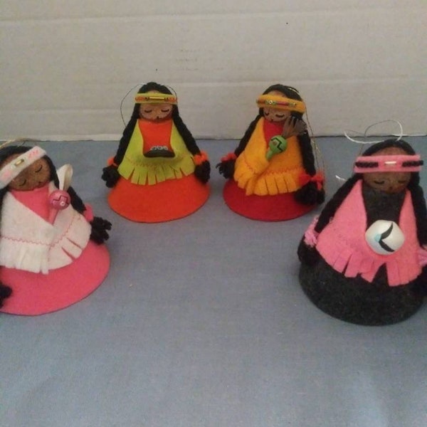 Four native American nut head dolls