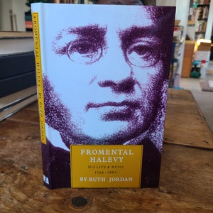 May include: A book titled "Fromental Halevy: His Life & Music 1799-1862" by Ruth Jordan. The cover features a black and white portrait of a man with a white background.