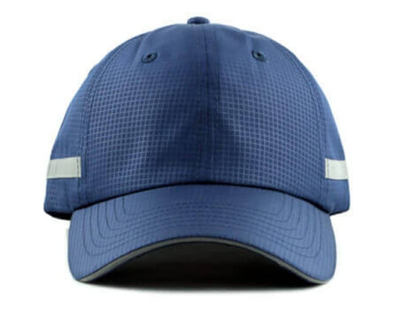 May include: A blue baseball cap with a reflective strip around the brim. The cap has a mesh design and a curved brim.