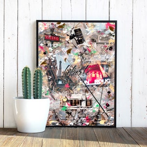 May include: A colorful collage print featuring the Eiffel Tower, a red sign with the text "Le Rougue", and the word "Liberte" in black script. The print is framed in a black frame.
