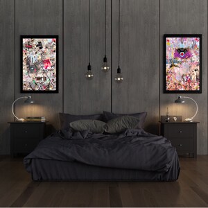 May include: A black bed with a dark gray headboard and a black comforter. Two black nightstands with lamps are on either side of the bed. Two framed pieces of art with colorful abstract designs hang on the wall behind the bed.