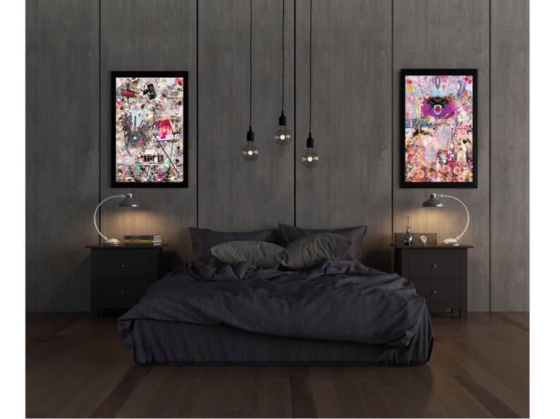 May include: A black bed with a dark gray headboard and a black comforter. Two black nightstands with lamps are on either side of the bed. Two framed pieces of art with colorful abstract designs hang on the wall behind the bed.
