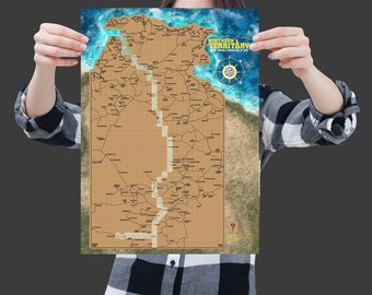 May include: A brown and tan map of the Northern Territory of Australia. The map shows the major roads and towns in the region. The map is surrounded by a blue border with a compass rose in the top right corner.