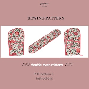 May include: A sewing pattern for double oven mitts. The mitts and the long oven pad feature a floral pattern with red and pink flowers on a cream background, outlined in pink. The text "SEWING PATTERN" is at the top.
