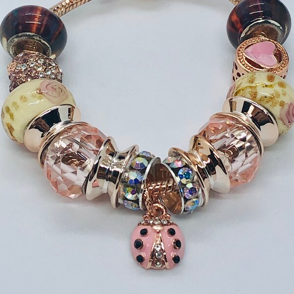 Pandora like charm bracelet. pink ladybug. Sparkle and shine on this great rhinestone glam bracelet. makes a great gift.