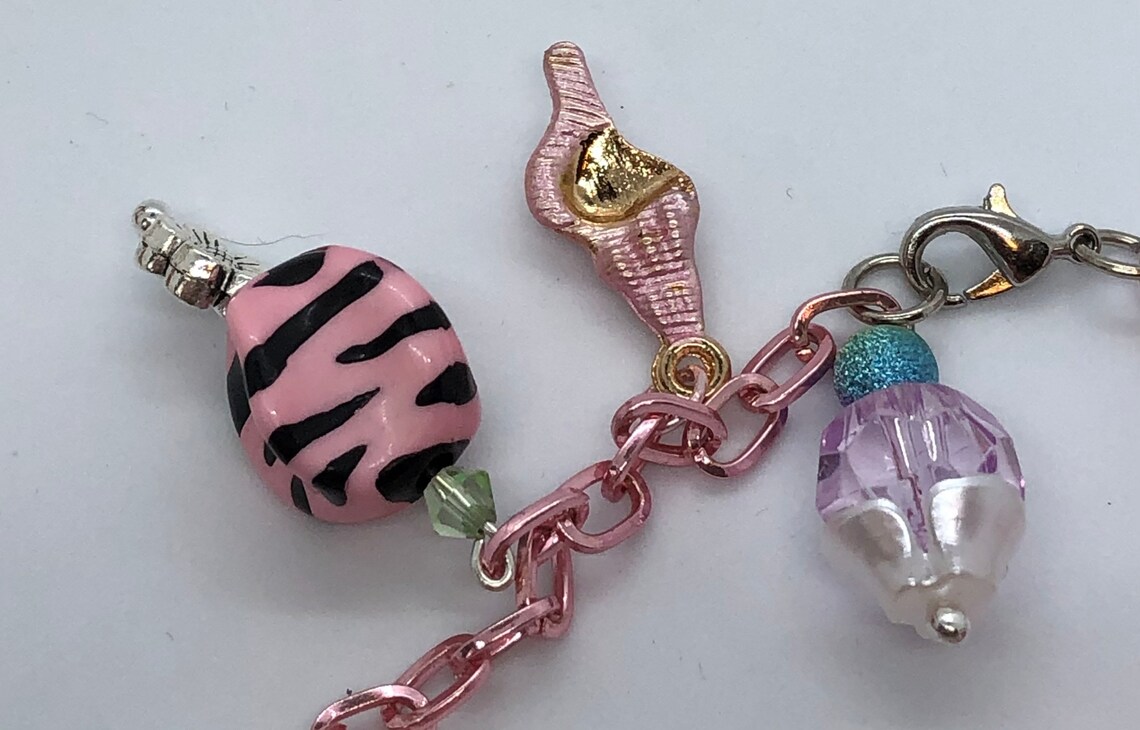 Charm bracelet dangle charms on a light pink metal bracelet Etsy