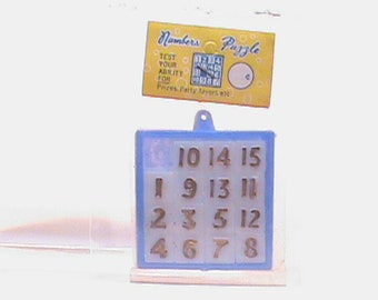Vintage Dime Store Number Game Toy In Original Packaging Enclosed In Protective Plastic