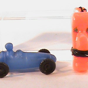 2-Vintage Made In Hong Kong Plastic Carnival Dime Store Toys Racer Easter Island Statue