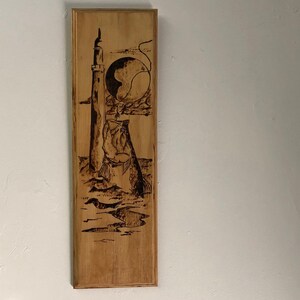 Tarpon and light house burn art