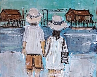 May include: An oil painting depicting two figures from behind, wearing white shirts and hats, standing on a beach. The figure on the left wears brown shorts, while the figure on the right wears a white dress and carries a black bag. Stilt houses are visible in the background against a blue sky.