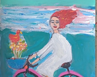 ビーチで自転車に乗る女性。アート絵画