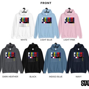 May include: A range of hooded sweatshirts in colours such as white, light blue, and pink. Each sweatshirt displays a graphic with the words "NO SIGNAL" above a colourful test pattern. Available colours include white, light blue, light pink, dark heather, black, indigo blue, and navy.